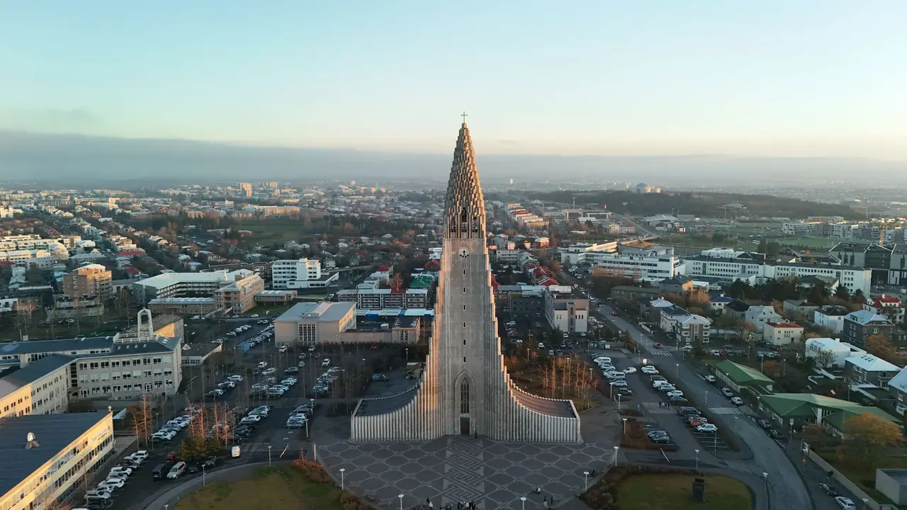Aerial view of Hallgrimskirkja church towering over the rooftops of central Reykjavik, Iceland